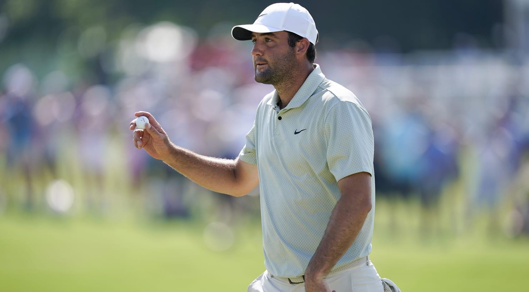 Scottie Scheffler's Perfect Round Propels Him to Commanding Lead at Memorial Tournament Here's a prioritized list of relevant keywords extracted from the article heading:
1. Scottie Scheffler
2. Perfect Round
3. Commanding Lead
4. Memorial Tournament
5. Golf
6. Tournament Performance
7. competitive Golf
These keywords should help you find targeted and appropriate images for your article